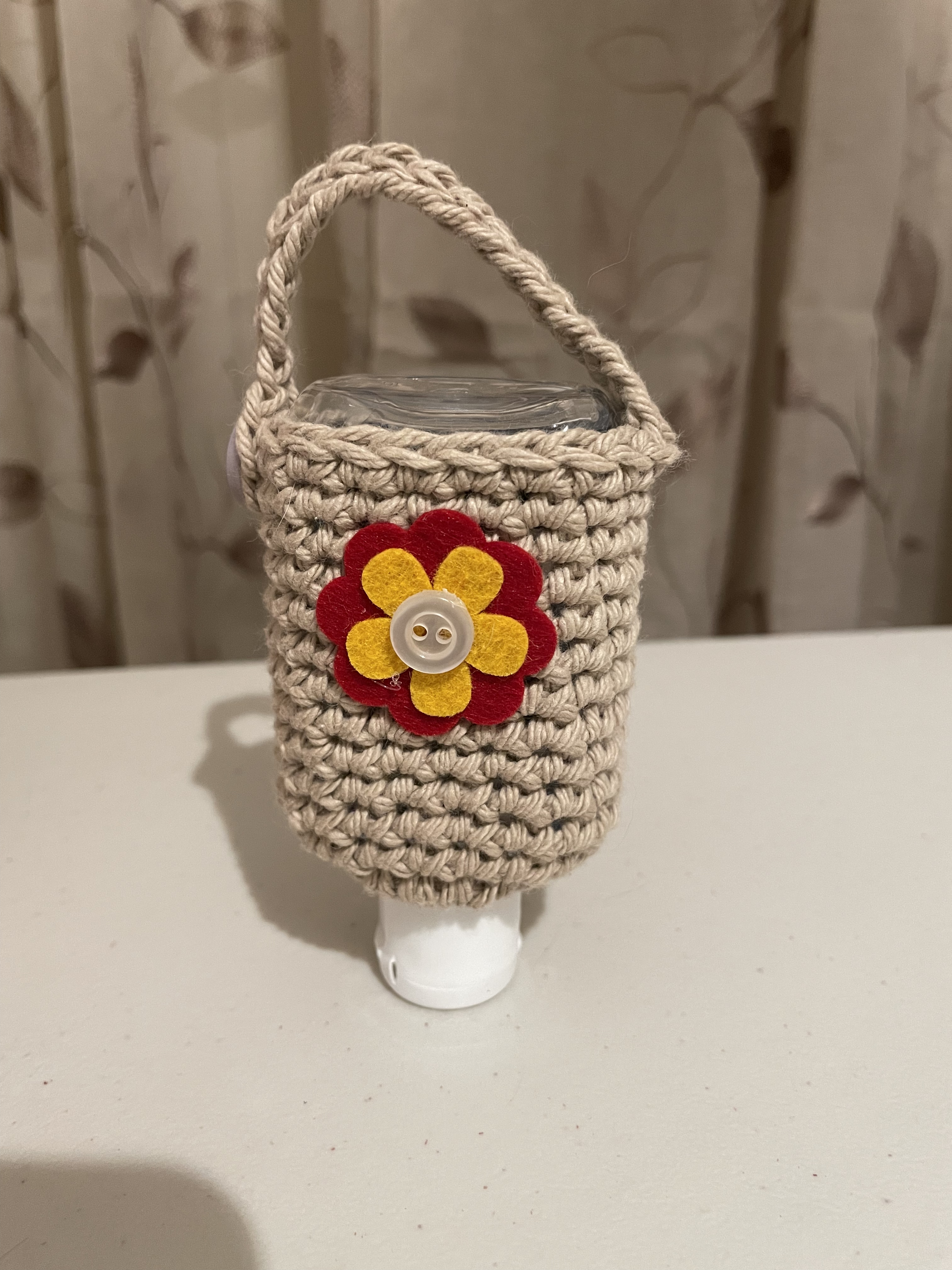 crochet hand sanitizer holder with flower
